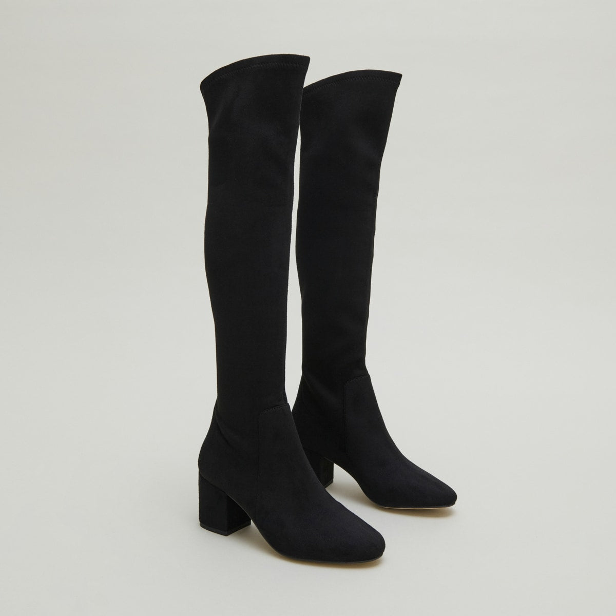 Thigh-high boots with low heels