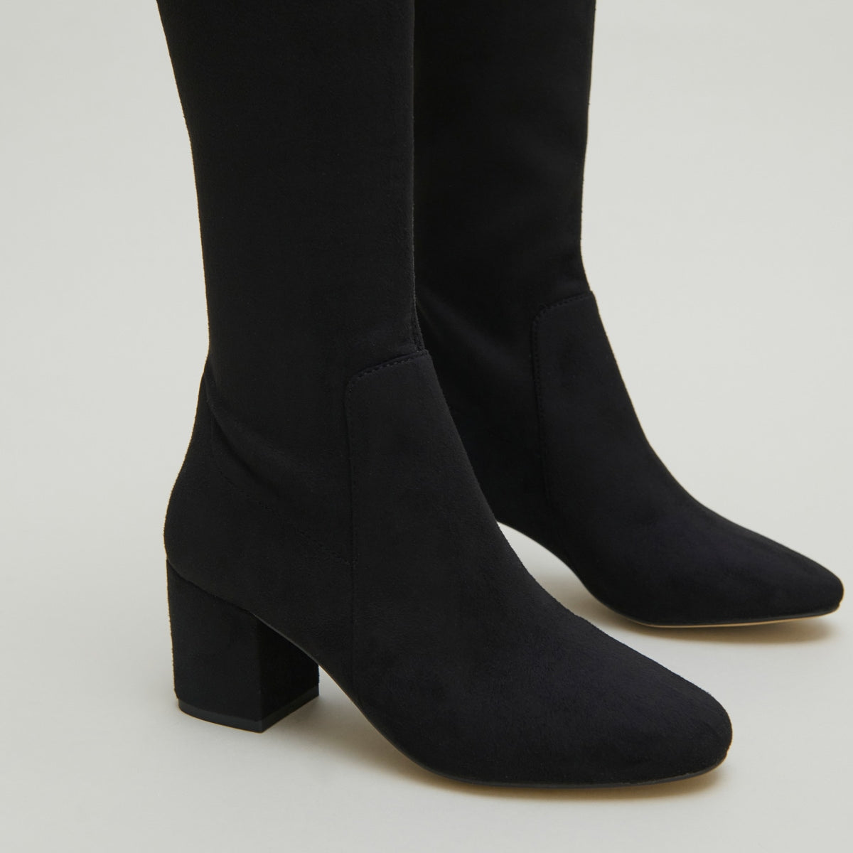 Thigh-high boots with low heels
